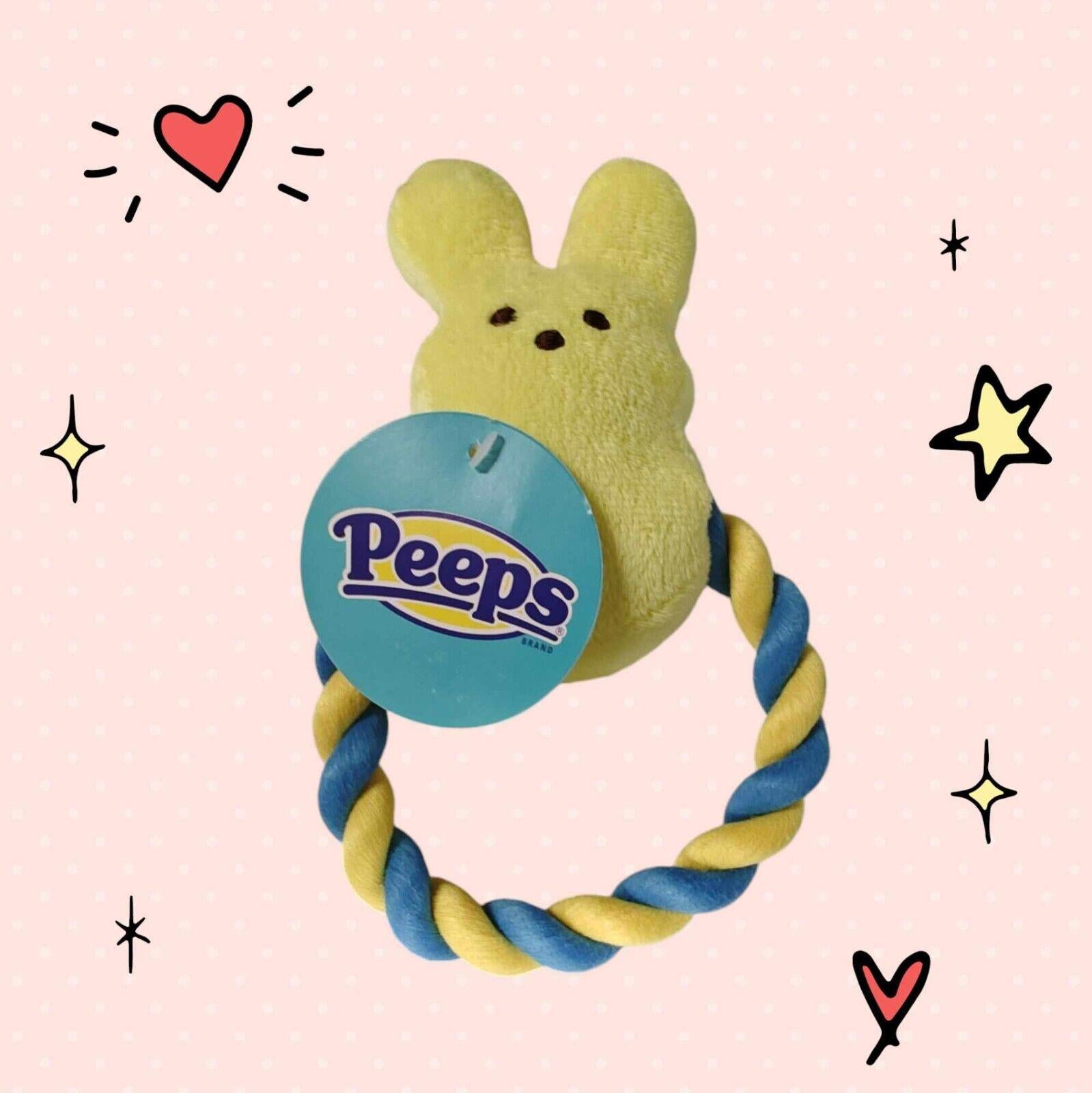Peeps plush toy with a yellow bunny design and a blue and yellow twisted ring.