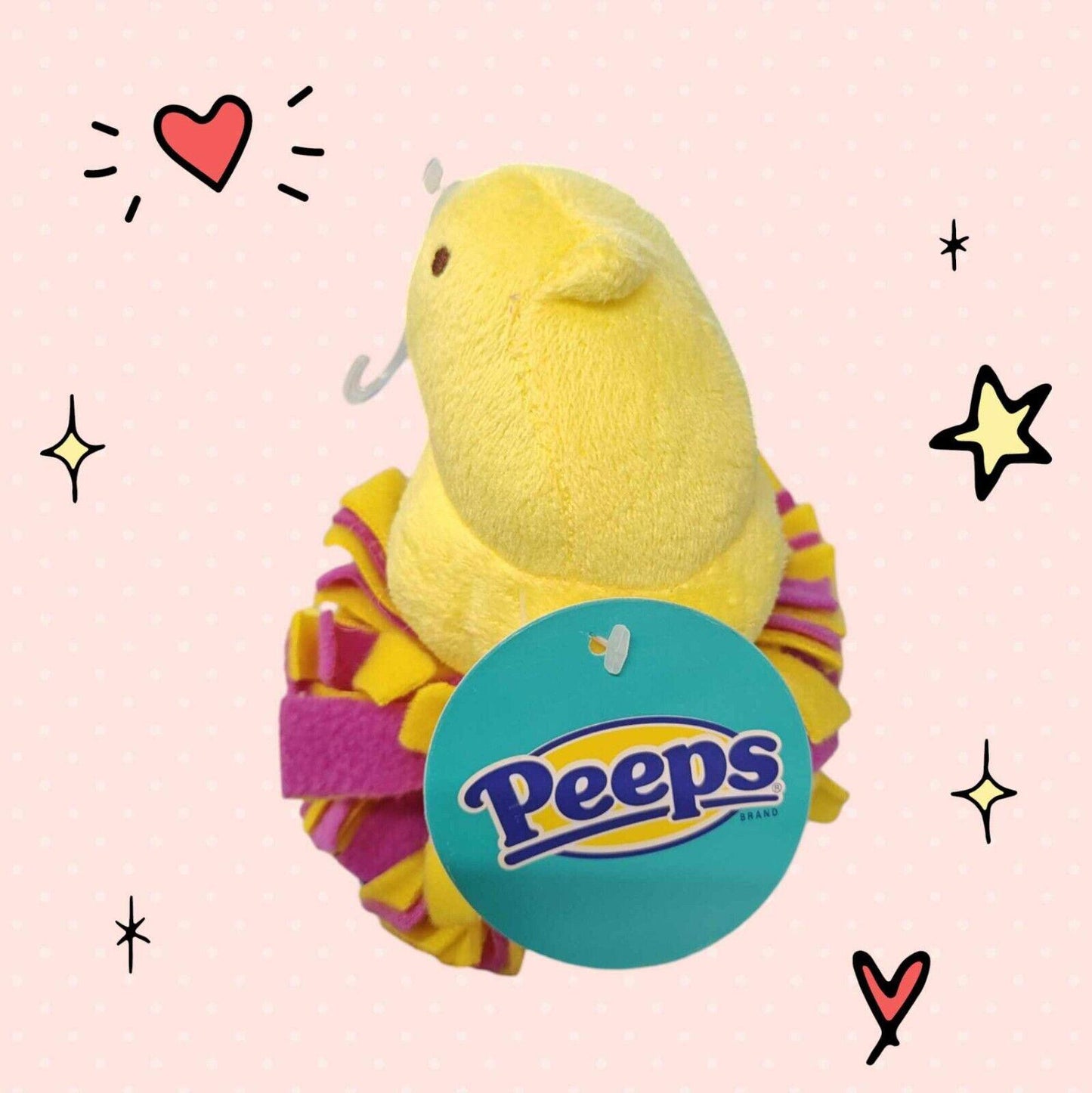 Peeps plush toy in yellow with colorful ruffles, perfect for Easter celebrations.
