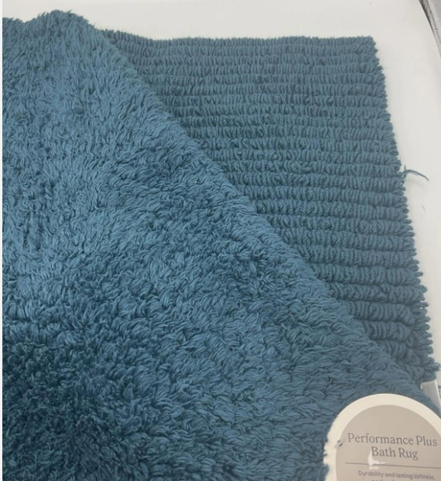 Performance Plus bath rug in teal color featuring plush texture and ribbed design.