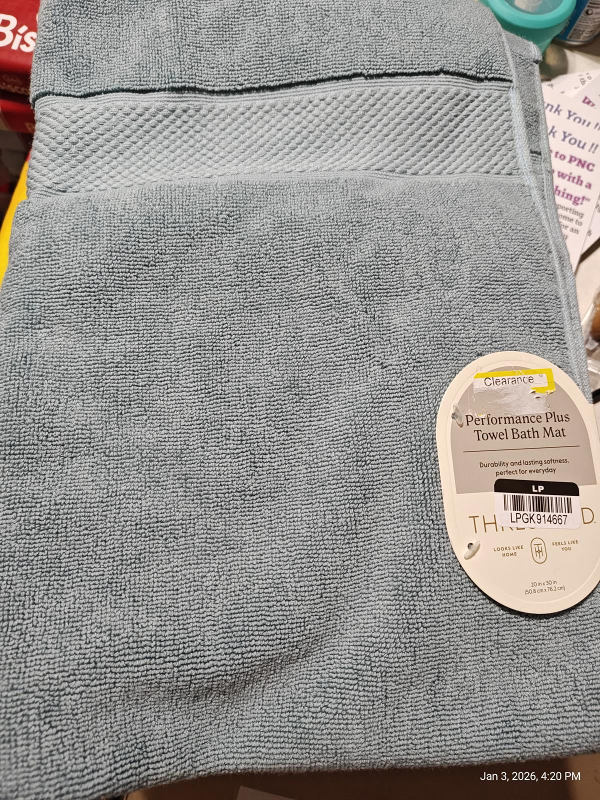 Performance Plus towel bath mat in soft blue color, featuring a textured design.