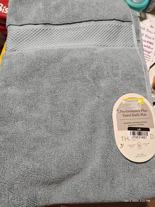 Performance Plus towel bath mat in soft blue color, featuring a textured design.