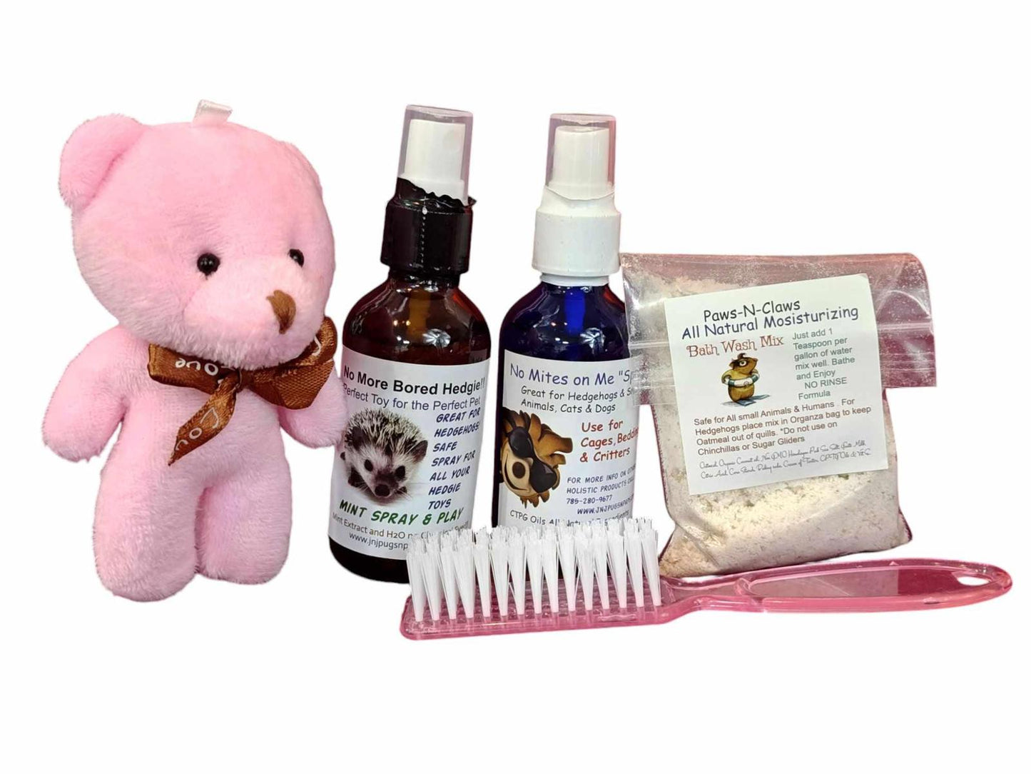 Pet Care Kit with Bear Plush Toy, grooming spray bottles, and powder for pets.
