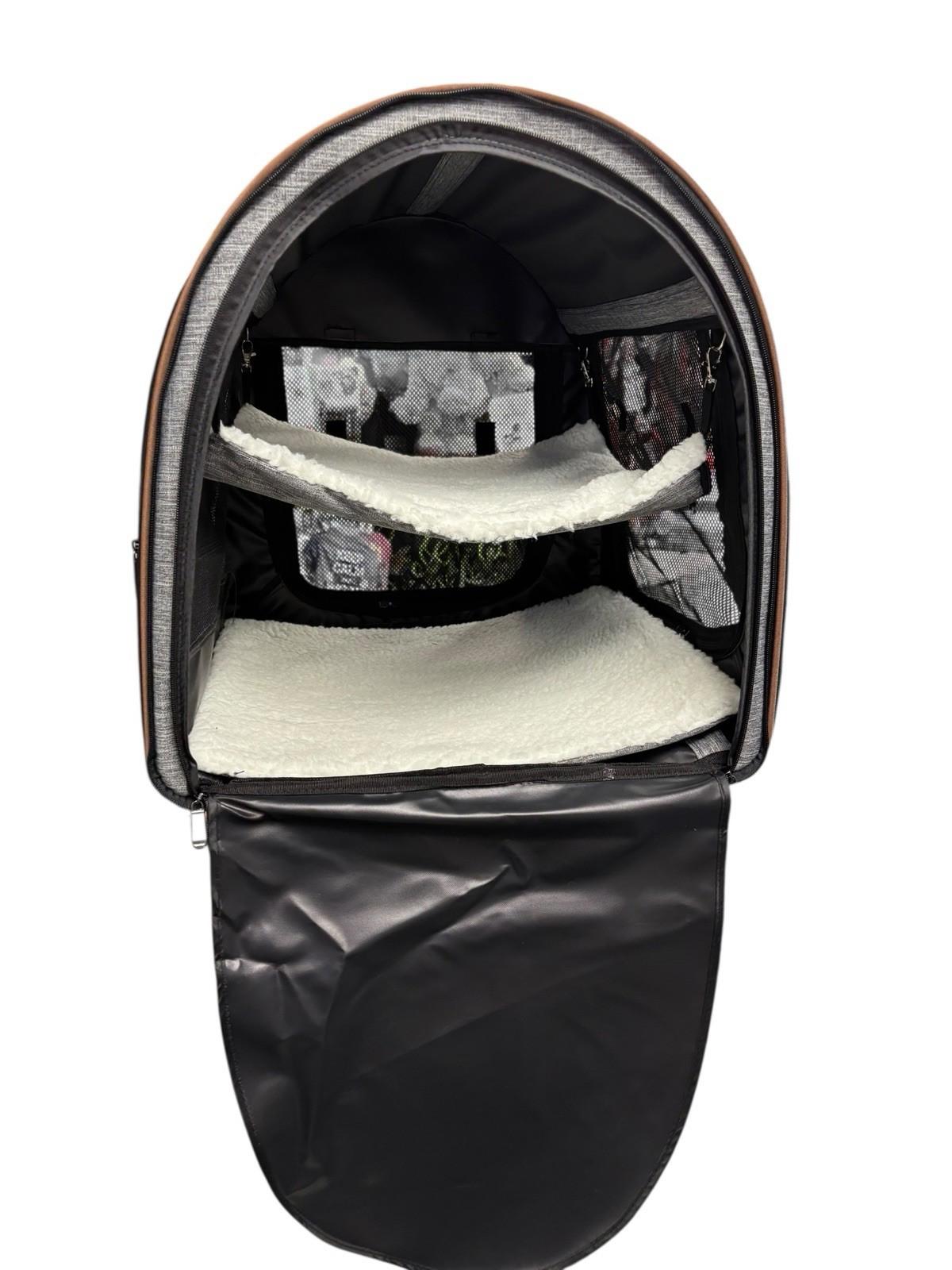 Pet Carrier Backpack features spacious interior with removable shelves and soft lining.