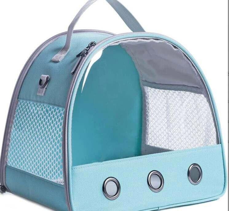 Pet carrier bag with a transparent front and mesh sides, featuring a light blue color.