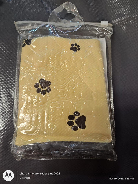 Pet Paw Print Cleaning Cloth, yellow with black paw prints, packaged for easy storage.