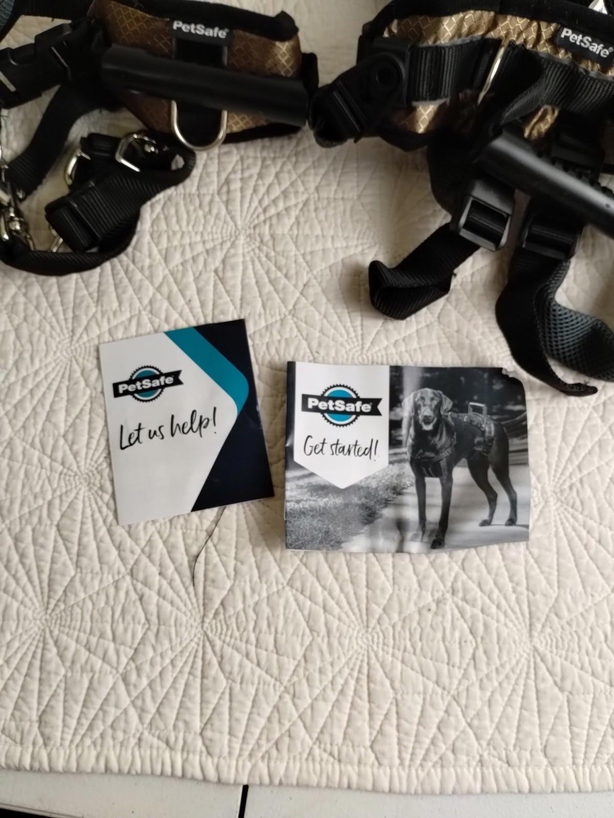 PetSafe harness and promotional materials for dog walking assistance.