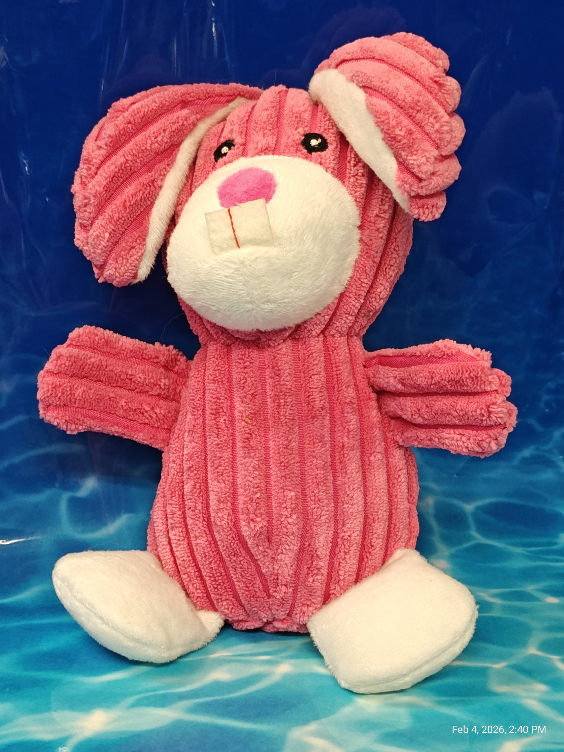 Pink Bunny Plush Toy with soft texture and floppy ears.