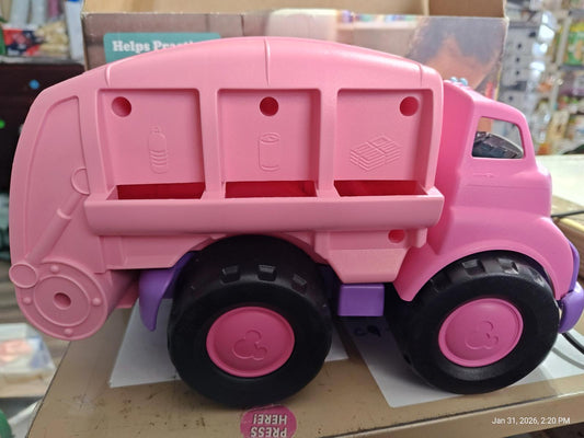 Pink toy garbage truck with three compartments for sorting waste.