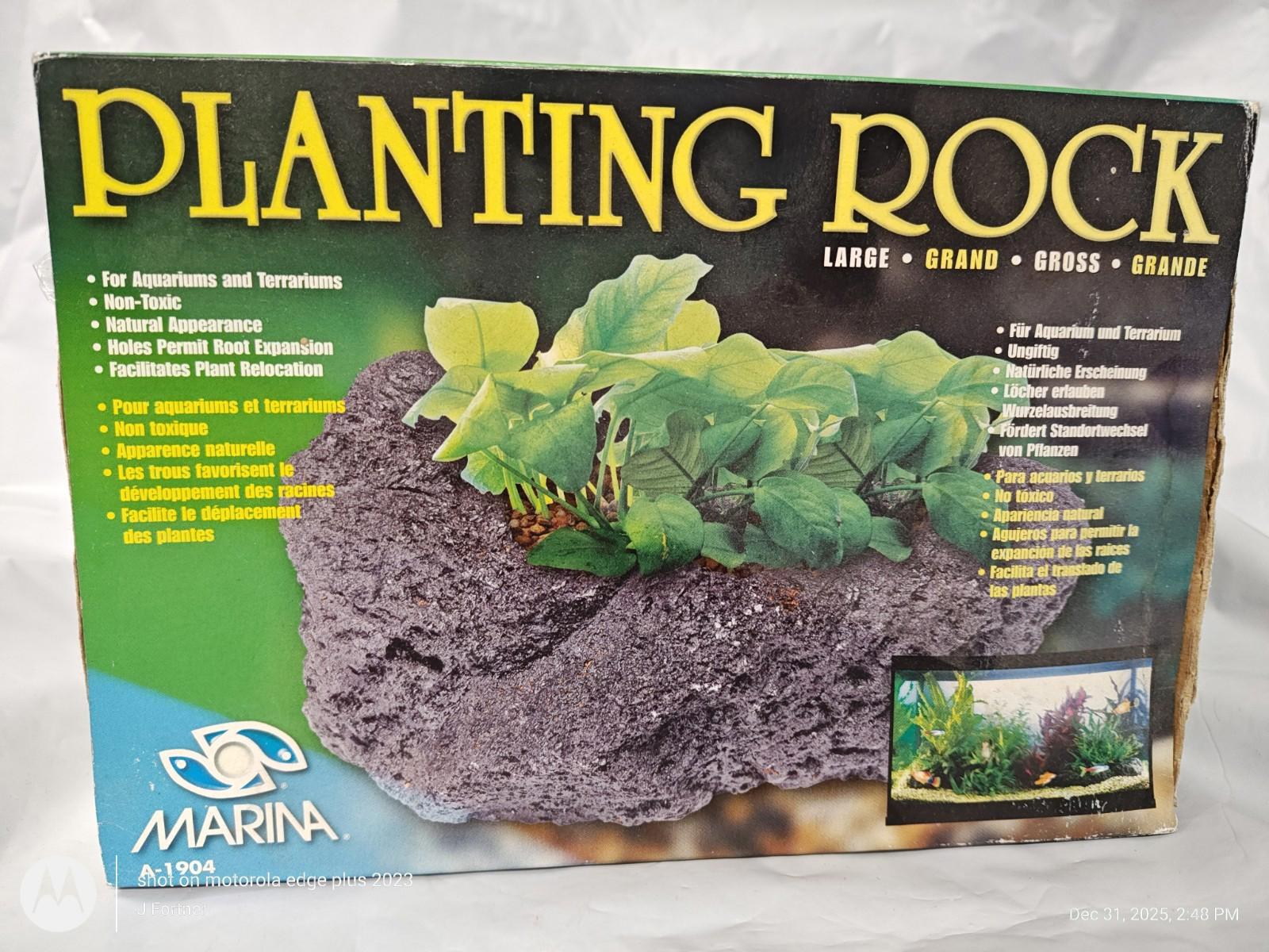 Planting Rock by Marina, ideal for aquariums and terrariums, featuring a natural look with green plants.