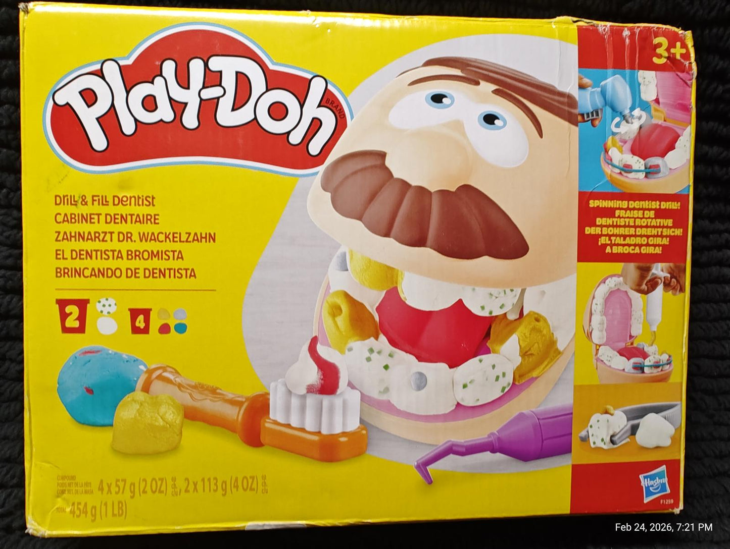 Play-Doh Dentist Set with colorful tools and a smiling character for creative play.