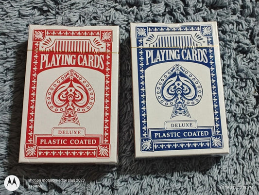 Playing cards set featuring red and blue deluxe plastic coated decks.