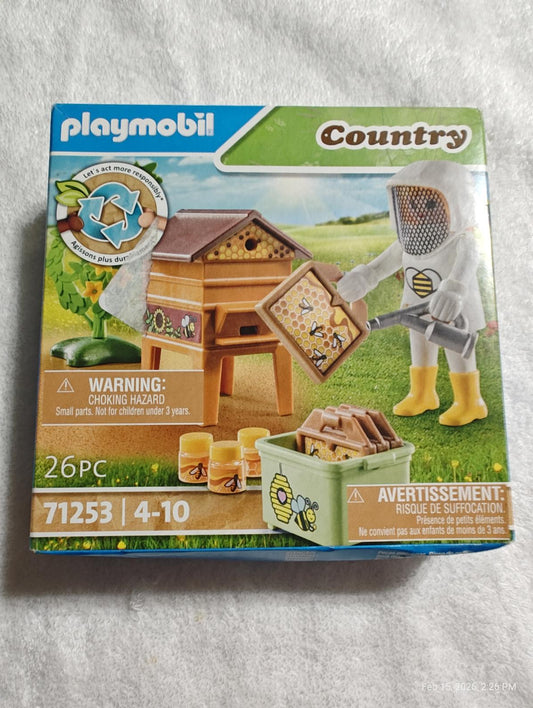 Playmobil Country beekeeping set with a wooden hive and accessories for kids aged 4-10.