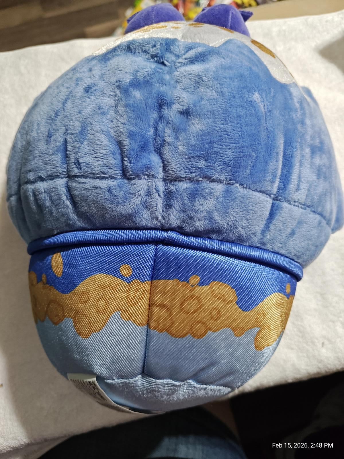 Plush Blue Character Hat featuring a soft texture and playful design.