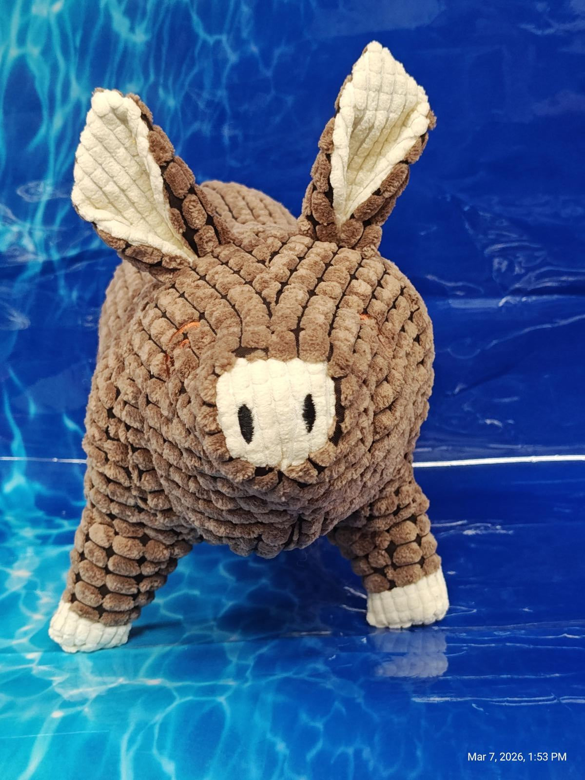 Plush Donkey Toy with textured brown body and white ears, perfect for cuddling.