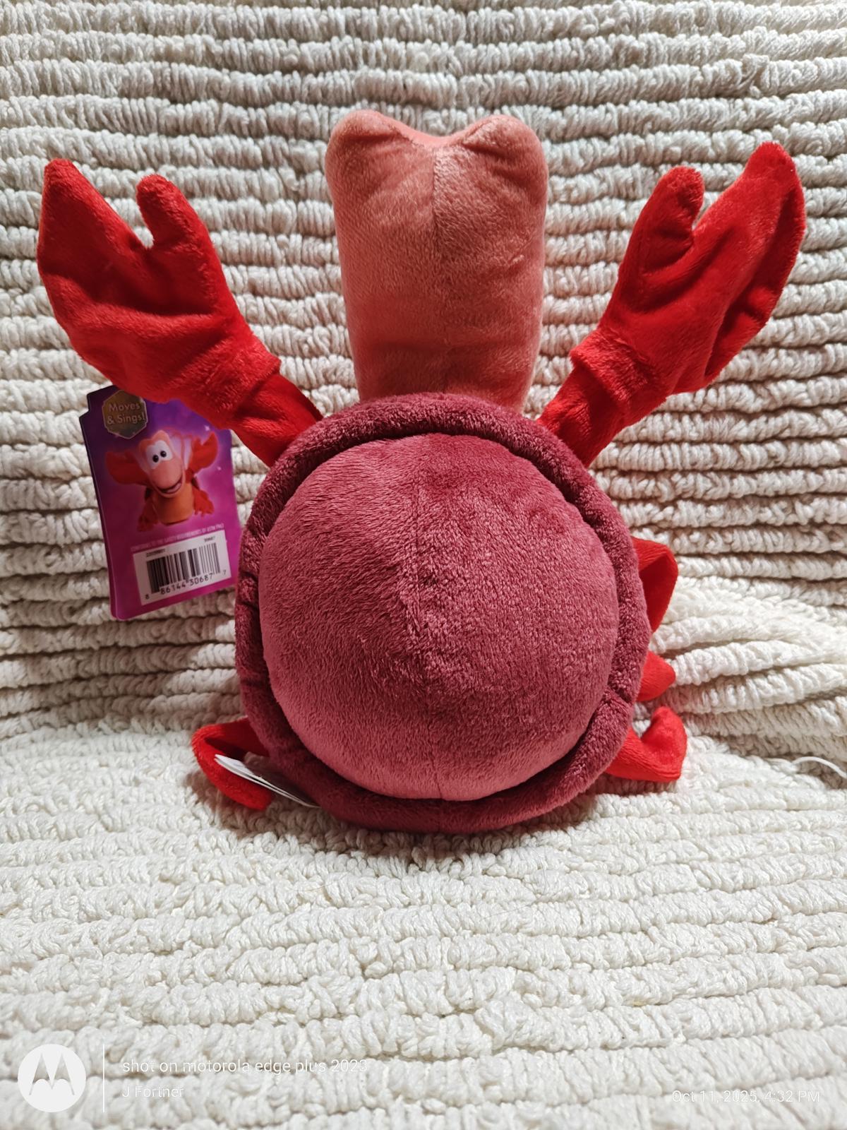 Cuddly Lobster Plush Toy with red claws and soft texture, perfect for kids.