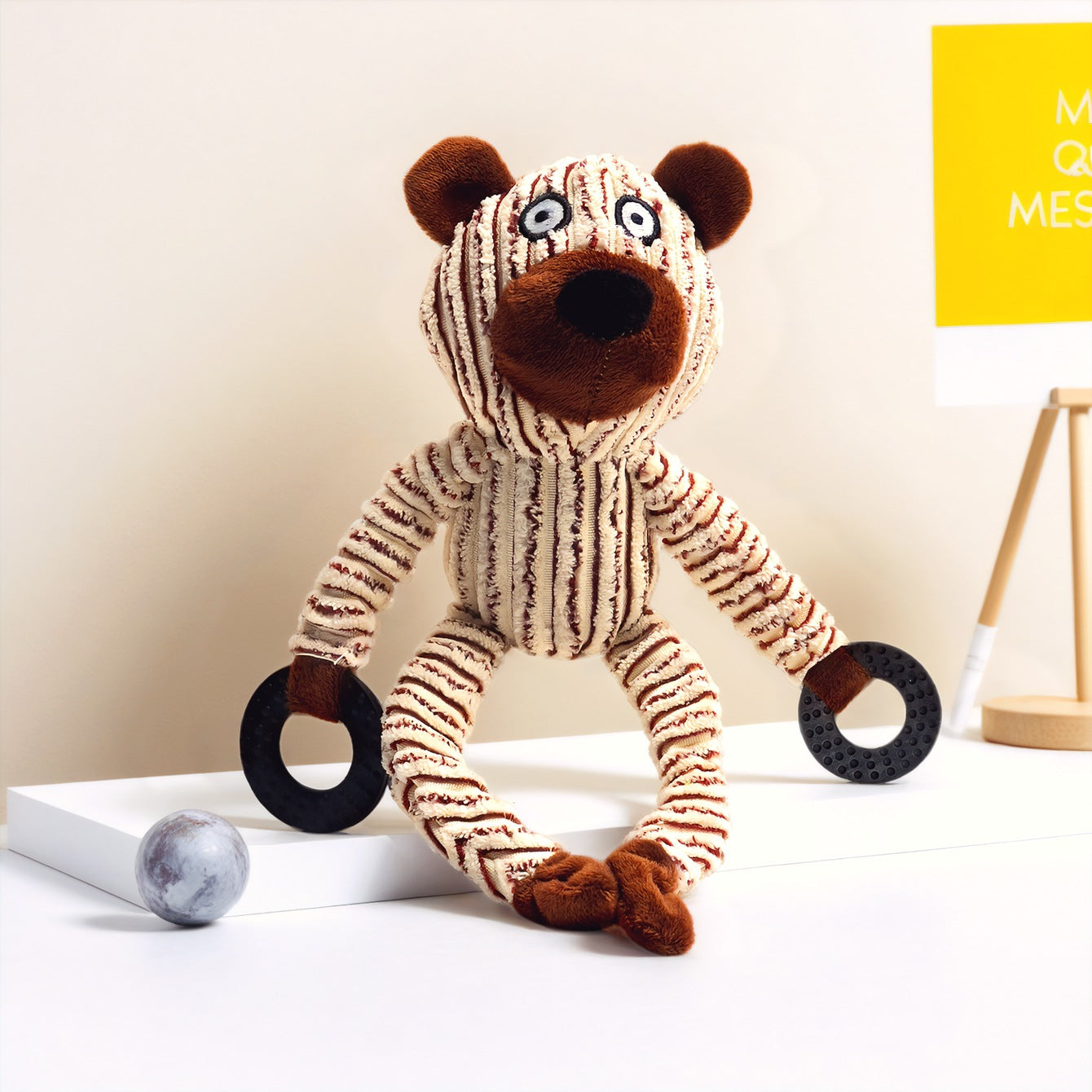 Plush Monkey Toy with striped design and black rings in hands, perfect for kids.