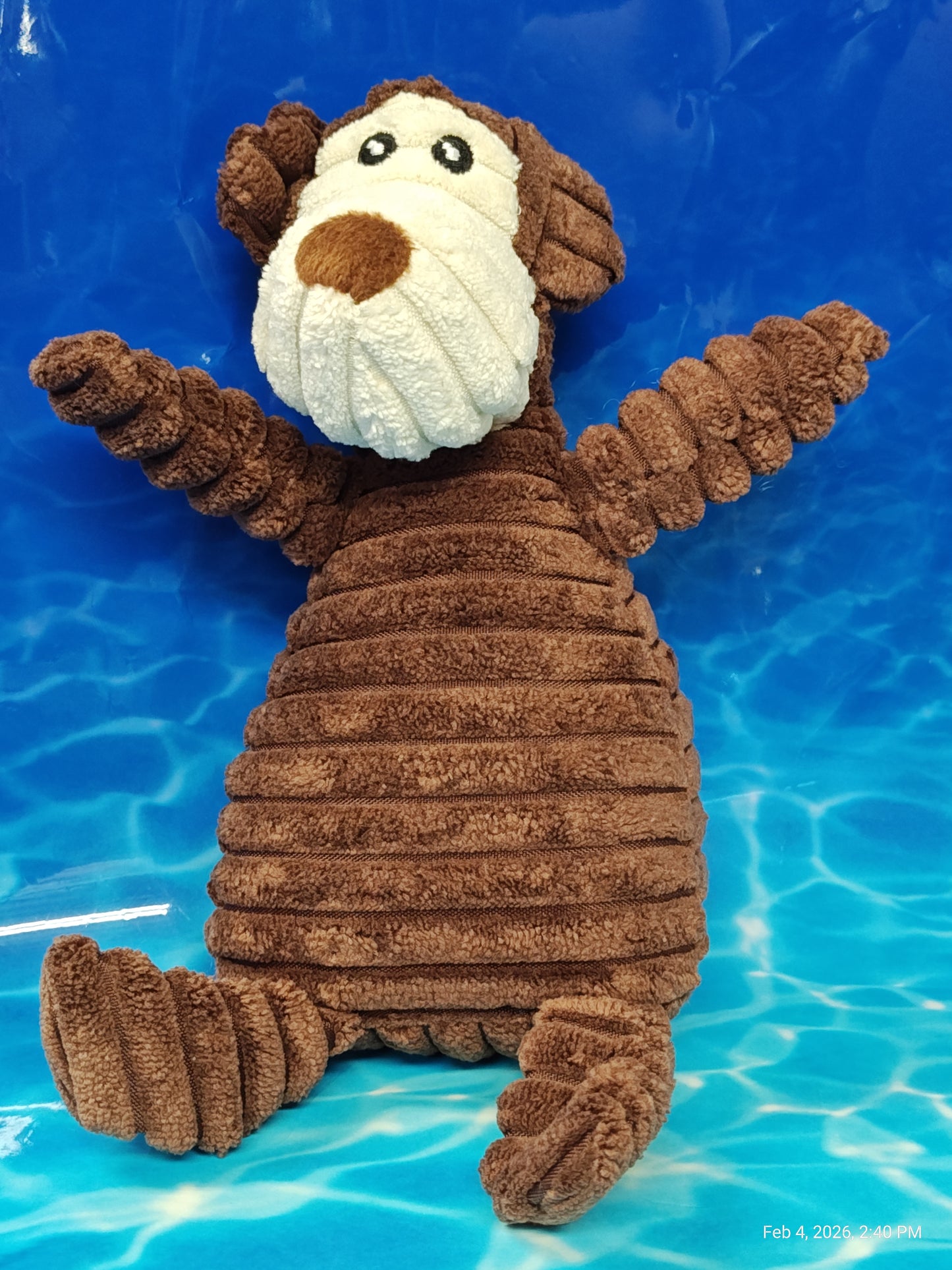 Plush Monkey Toy with a textured brown body and a smiling face, perfect for cuddling.