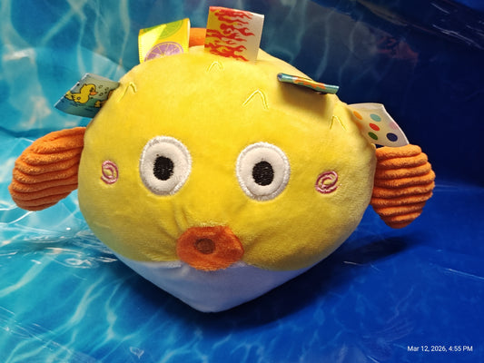 Plush Puffer Fish Toy with colorful tags and soft texture.