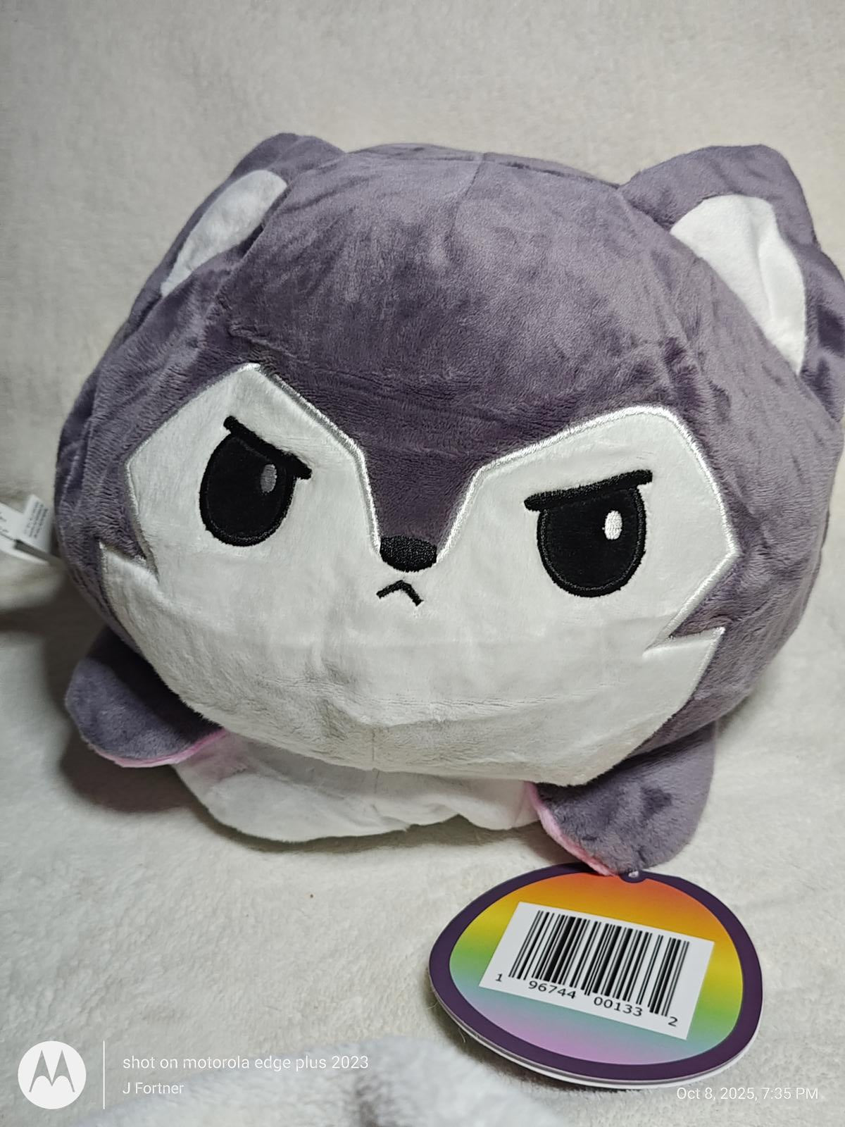 Plush Wolf Toy featuring a gray and white design with an angry expression.