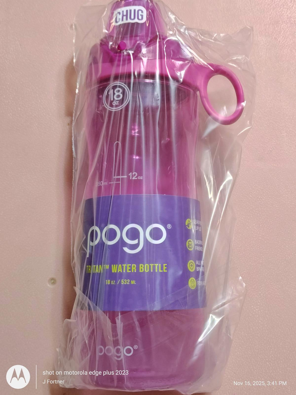 Pogo chug water bottle in pink color with a 32 oz capacity and a convenient handle.