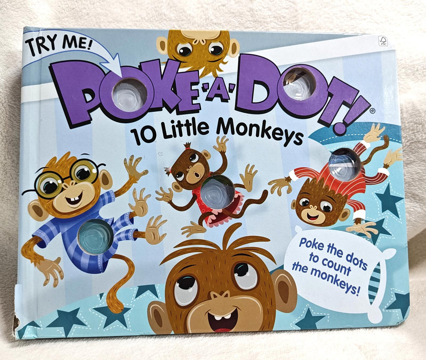 Poke-a-Dot! 10 Little Monkeys game featuring colorful monkey illustrations and dot-poking holes.