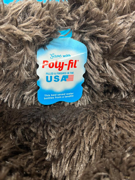 Poly-fil plush fabric tag showing it's filled and finished in the USA.