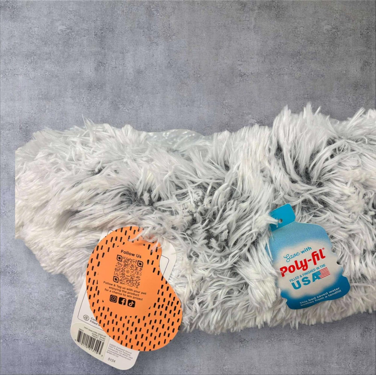 Poly-Fil plush fabric in soft gray color with fluffy texture.