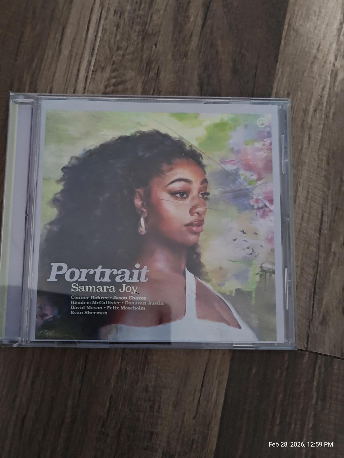 Portrait Samara Joy album cover featuring a woman with curly hair and floral background.