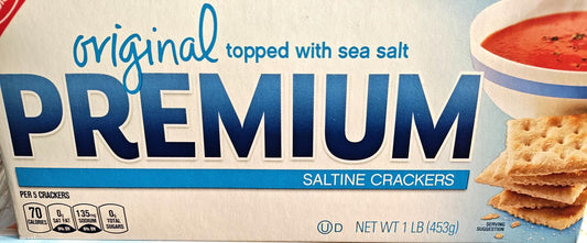 Premium saltine crackers topped with sea salt, perfect for snacking or pairing with soup.