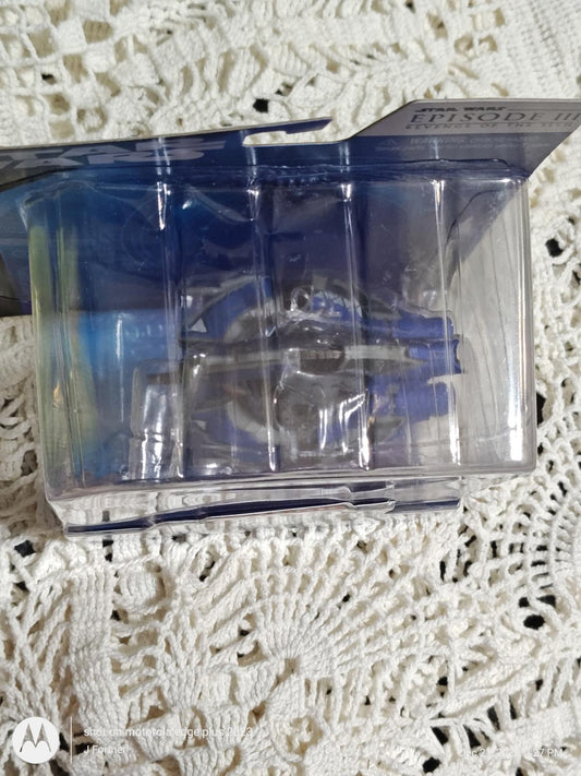 Product name not provided. Clear packaging with a blue design showcasing the item inside.