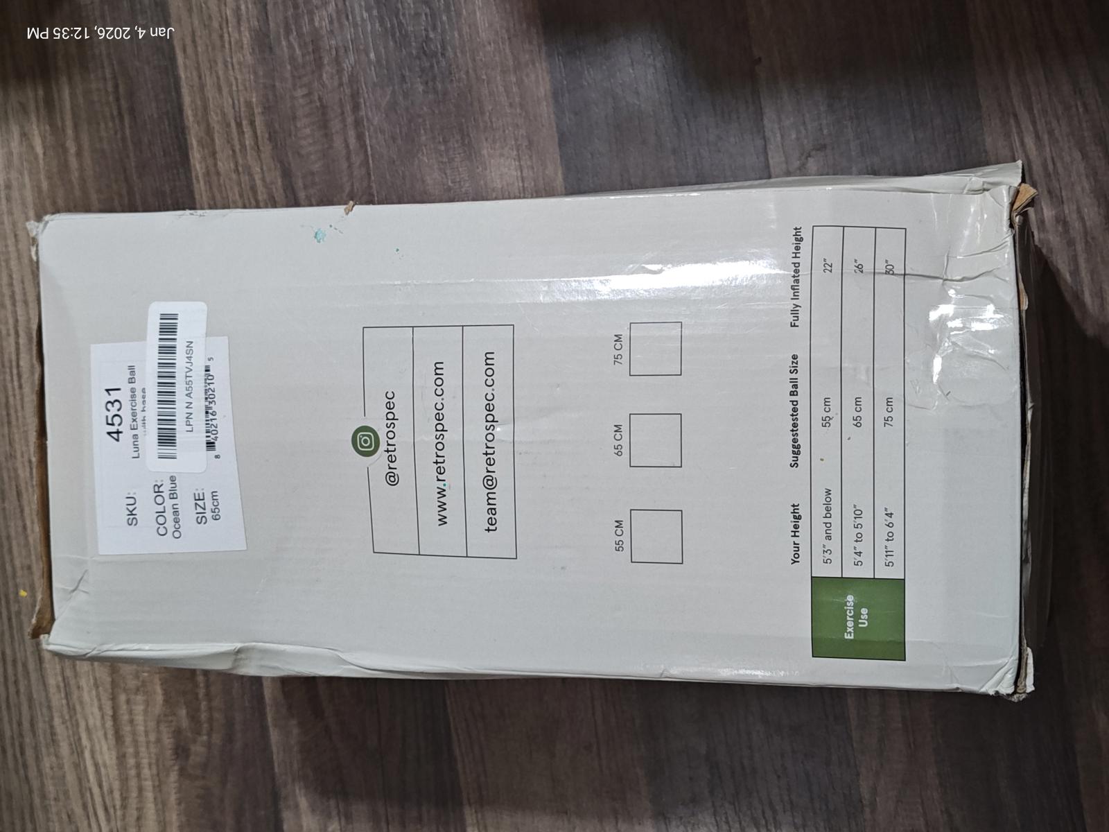Product packaging box with shipping label and green logo.