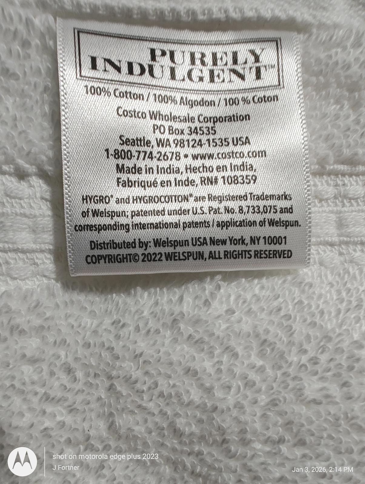 Purely Indulgent cotton fabric label showing 100% cotton composition and care instructions.