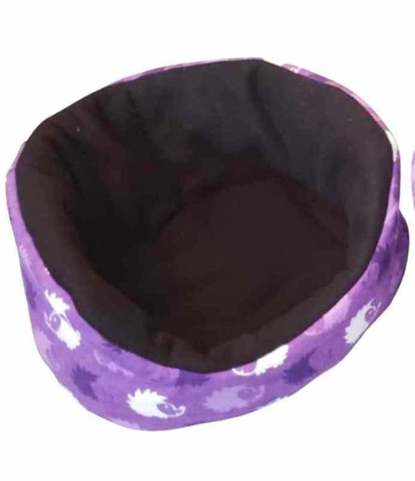 Purple pet bed featuring a soft interior and playful hedgehog design.