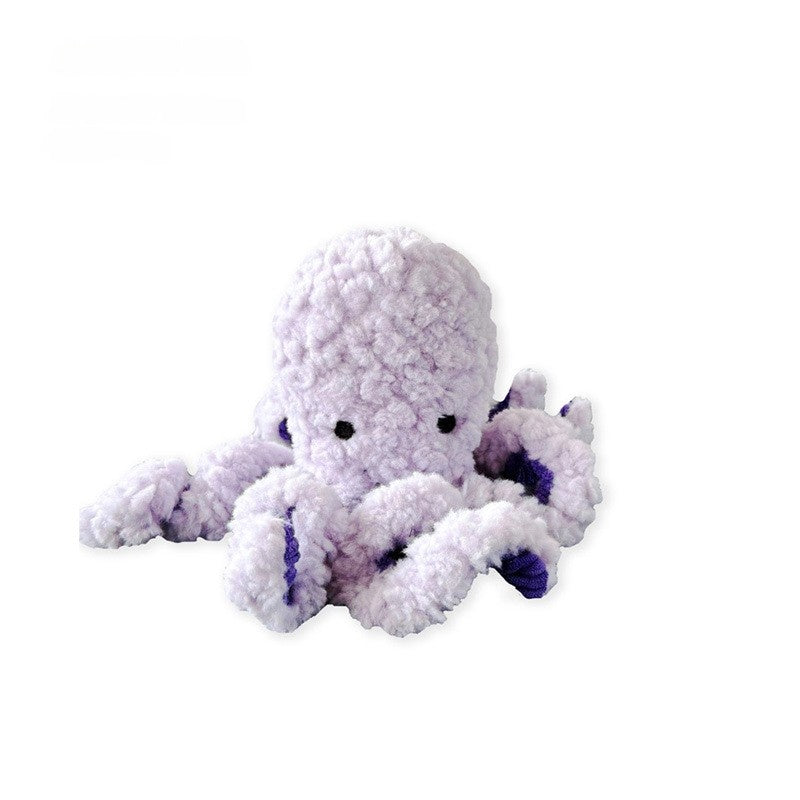 Purple plush octopus toy with soft, fluffy texture and cute facial features.