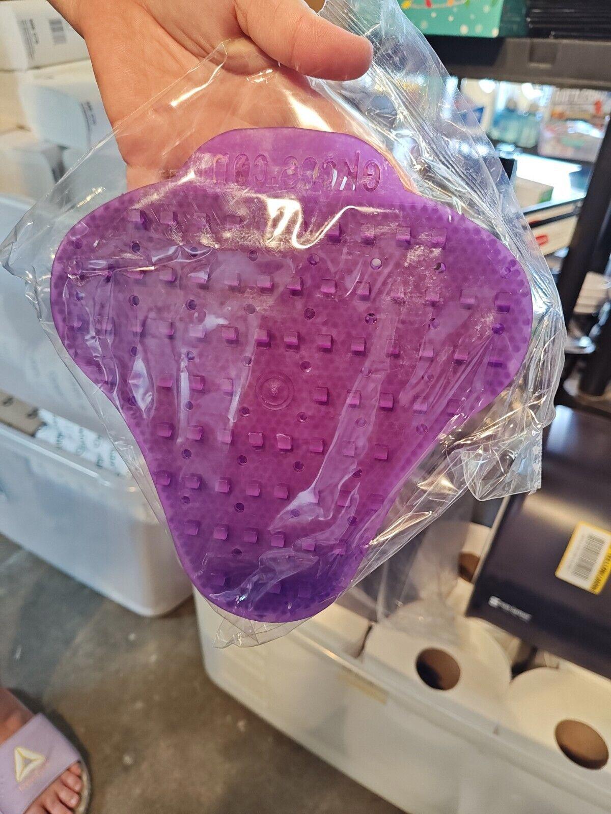 Purple silicone foot massager with textured surface for relaxation.