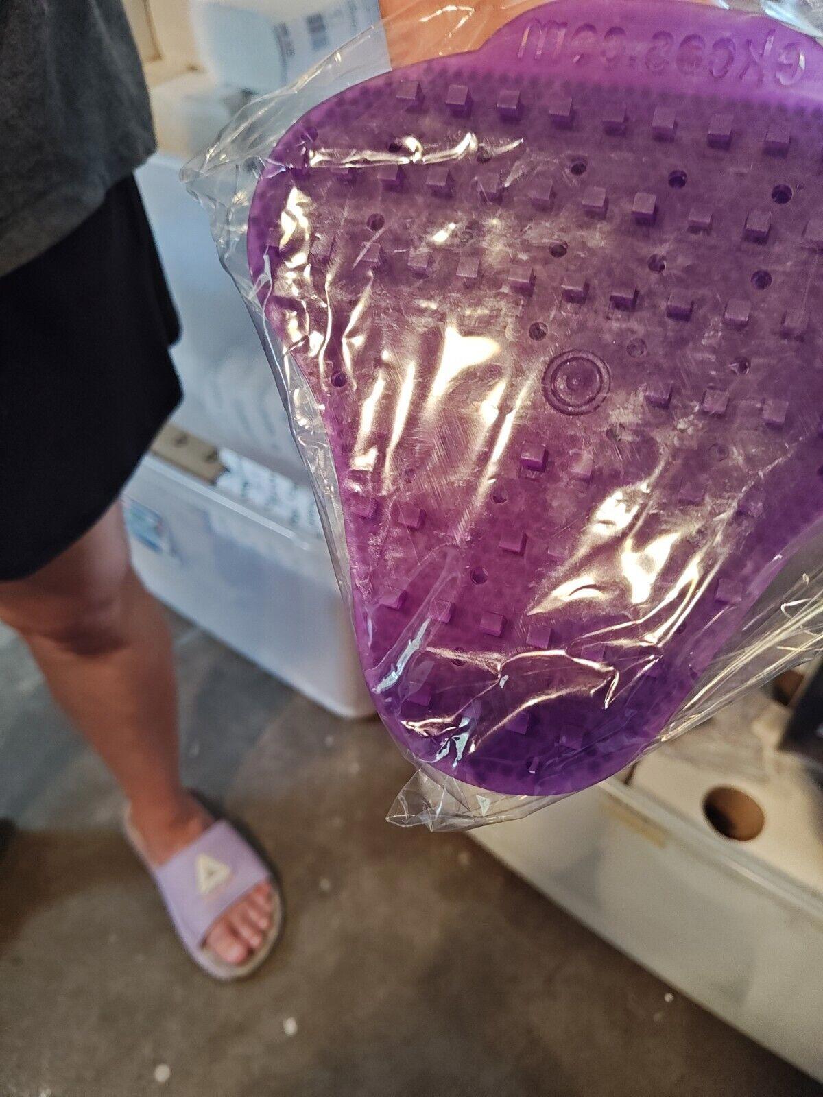 Purple silicone scrubber for cleaning, featuring a textured surface and ergonomic design.