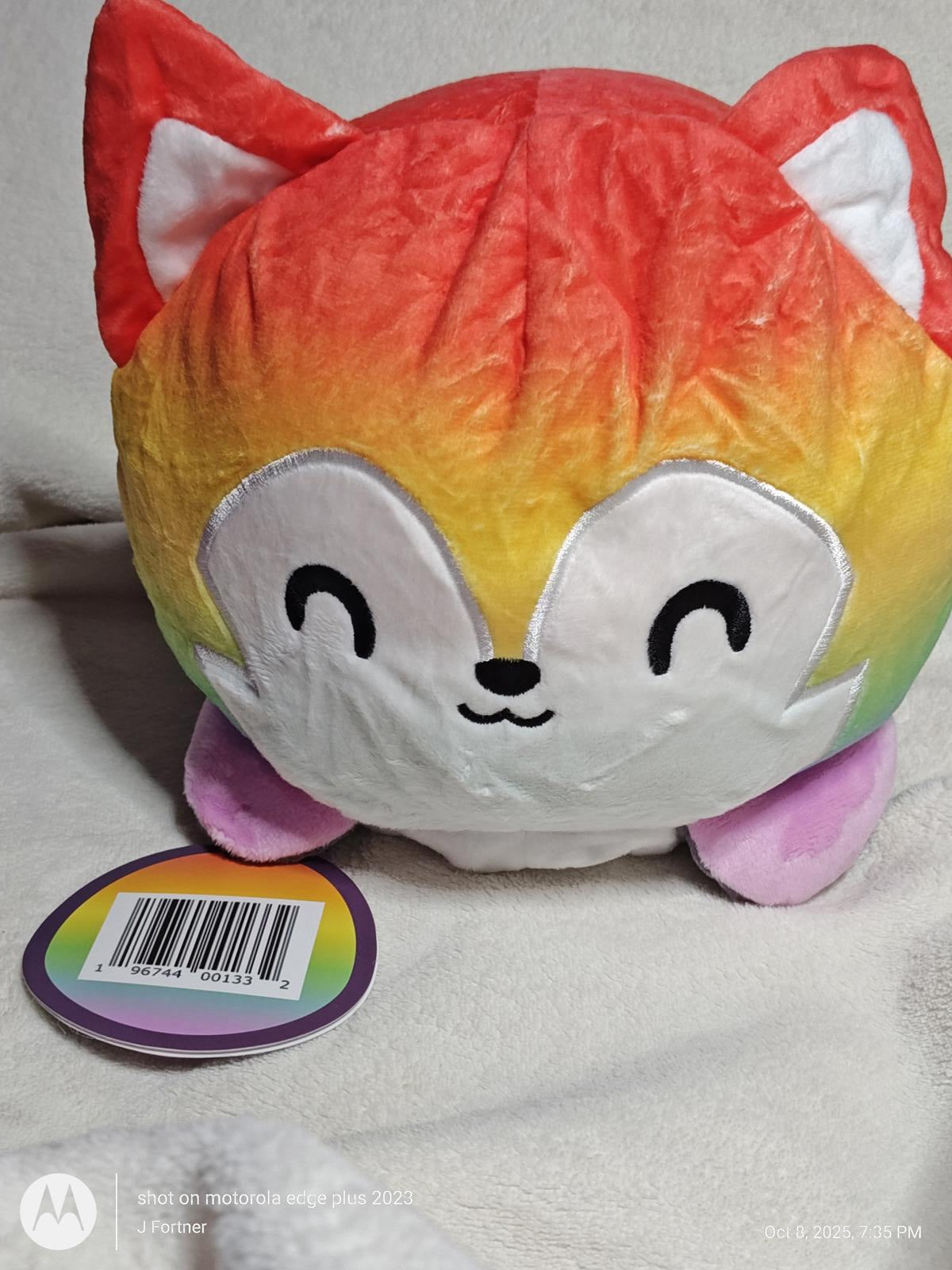 Rainbow Fox Plush Toy with a smiling face and colorful fur.