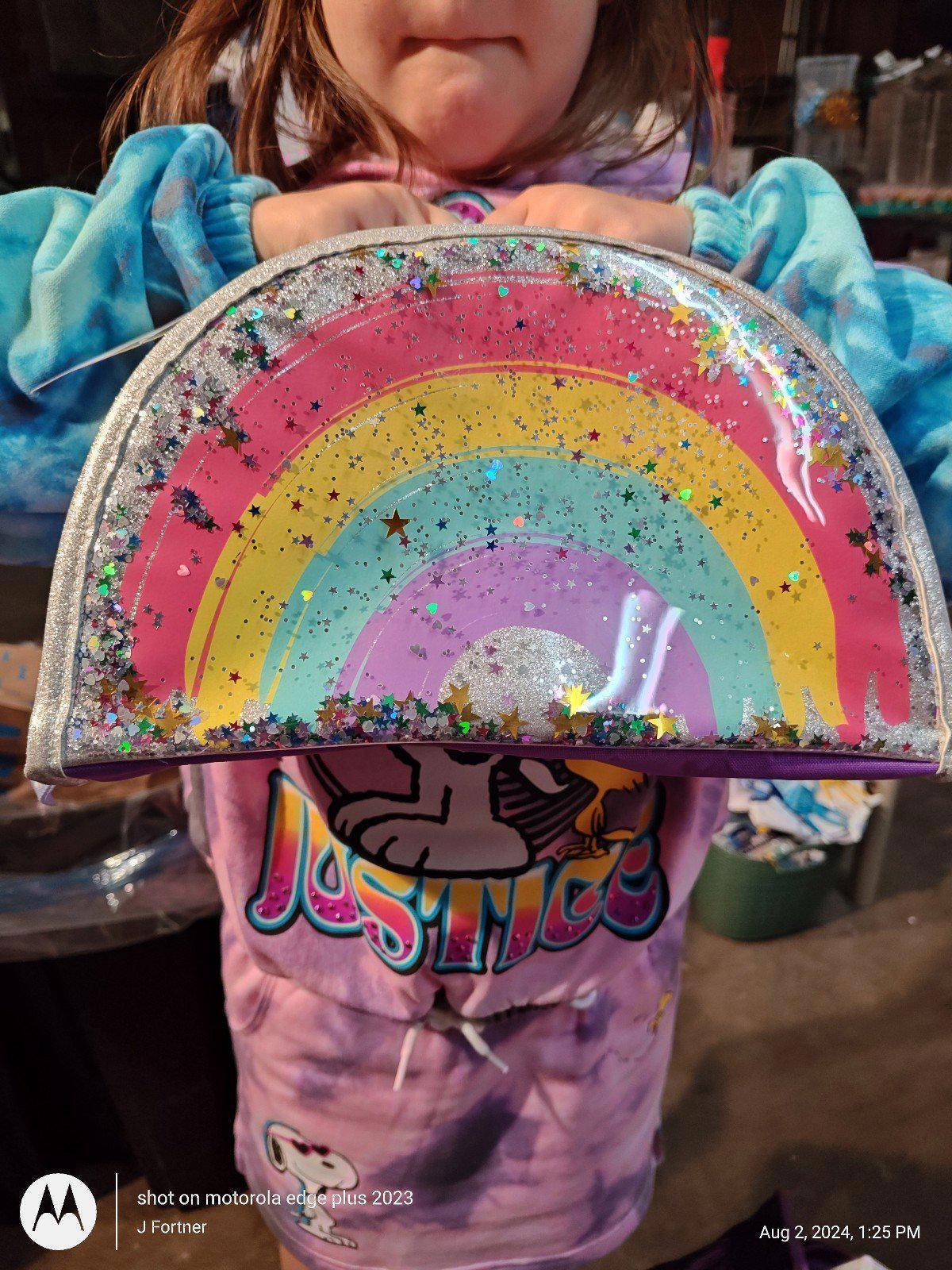 Rainbow glitter handbag featuring vibrant colors and sparkles.