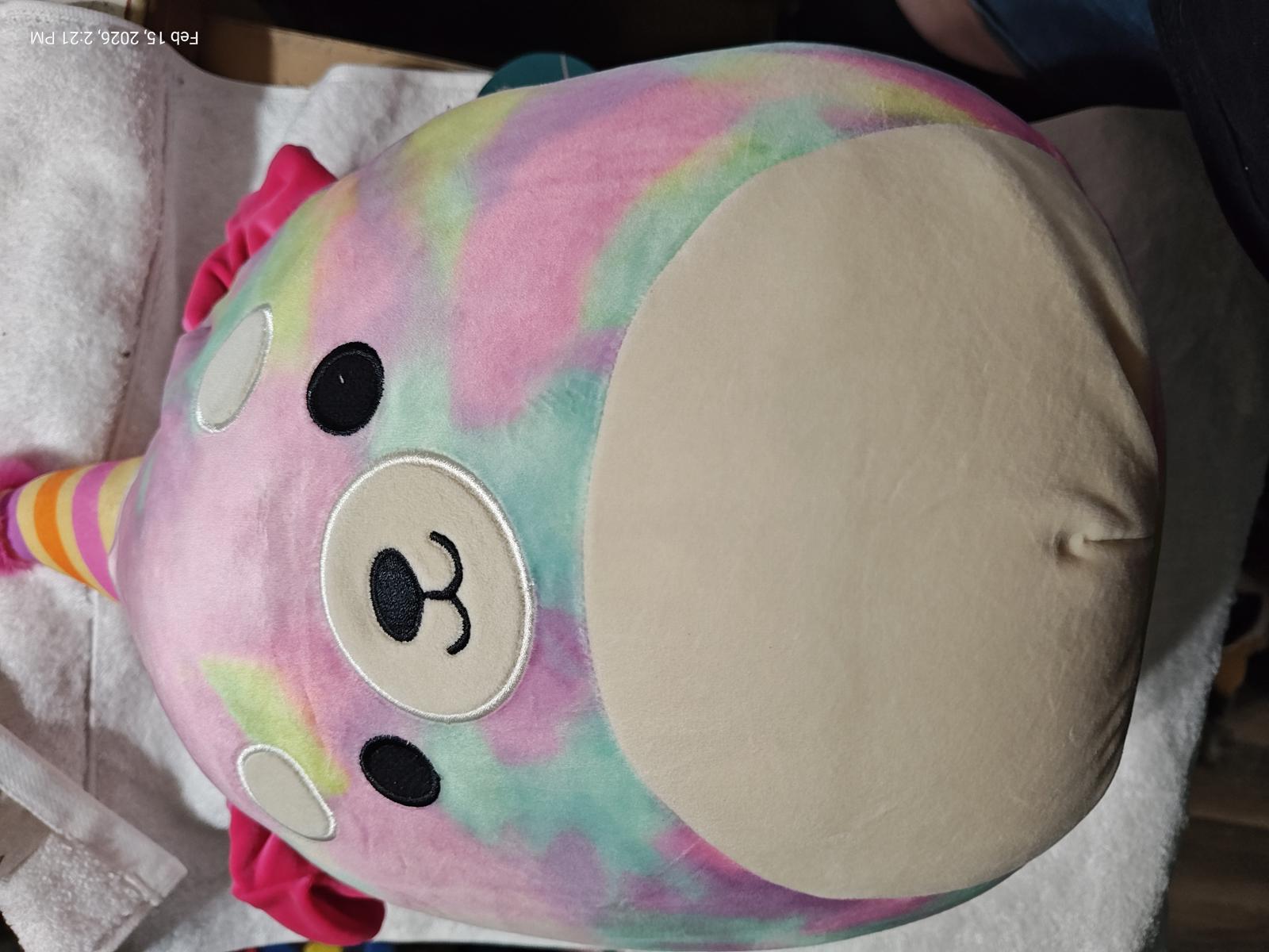 Rainbow Narwhal Plush Toy with a soft, colorful design and cute facial features.