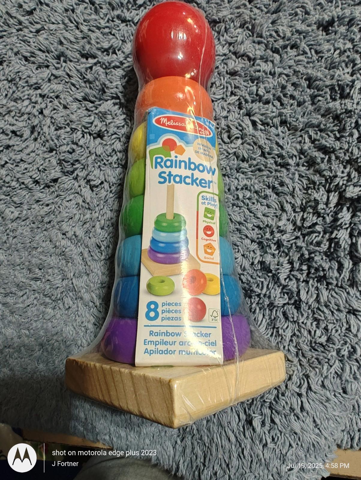 Rainbow Stacker toy featuring colorful rings and a red top, designed for stacking and learning.