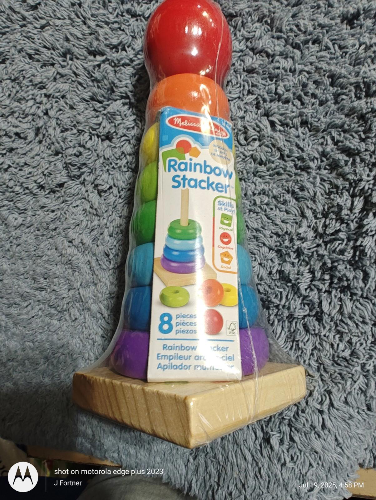 Rainbow Stacker toy featuring colorful rings and a wooden base for stacking.