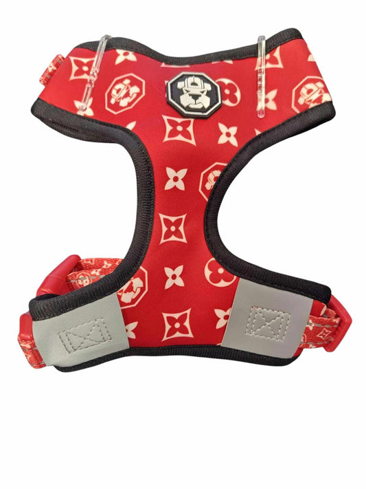 Red dog harness featuring a stylish pattern and adjustable straps for comfort.