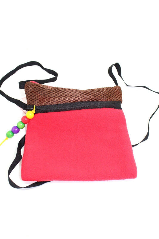 Colorful red fleece crossbody bag with a brown mesh top and decorative beads.