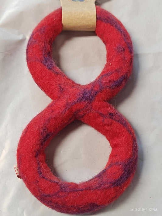 Red and purple felt dog toy shaped like the number eight.