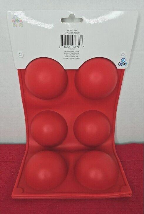 Red silicone ice ball mold with six spherical cavities for making ice balls.