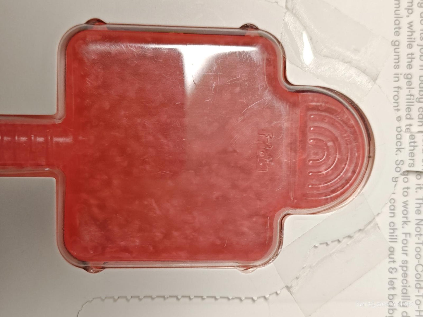 Red silicone ice cube tray with a unique shape for easy ice removal.