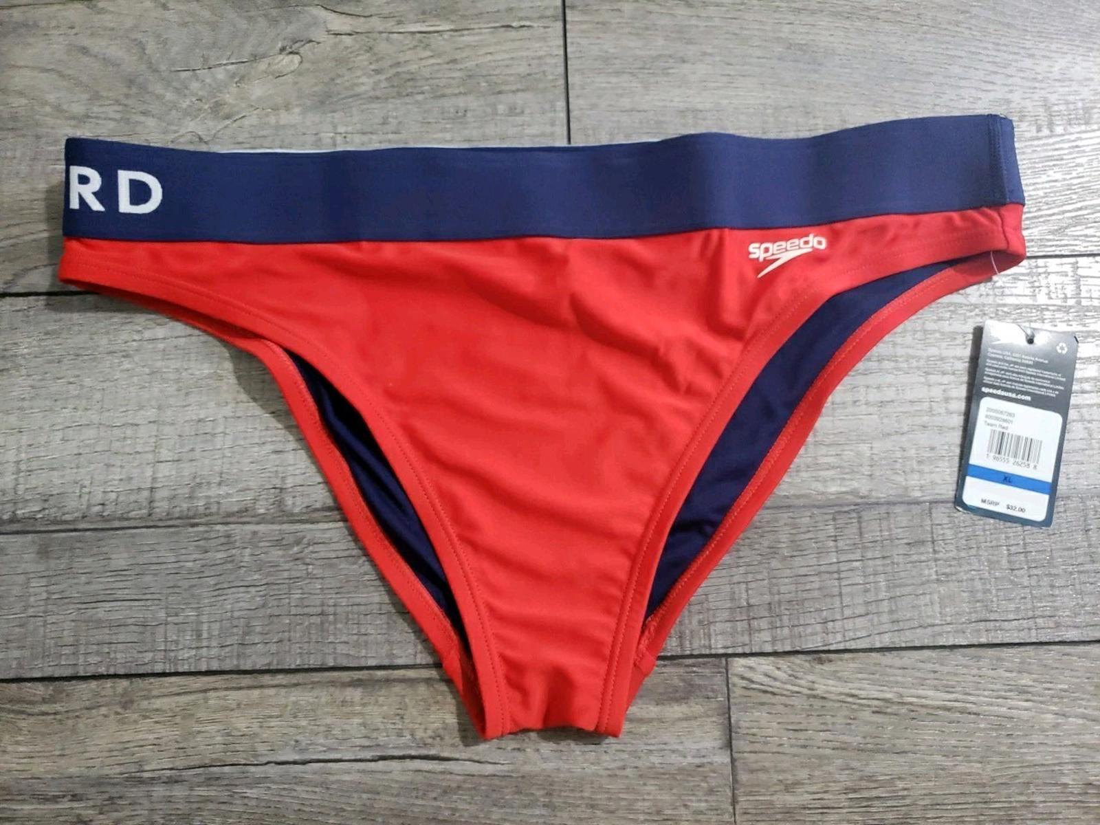 Red Swim Briefs with Navy Blue Waistband featuring logo and tag.