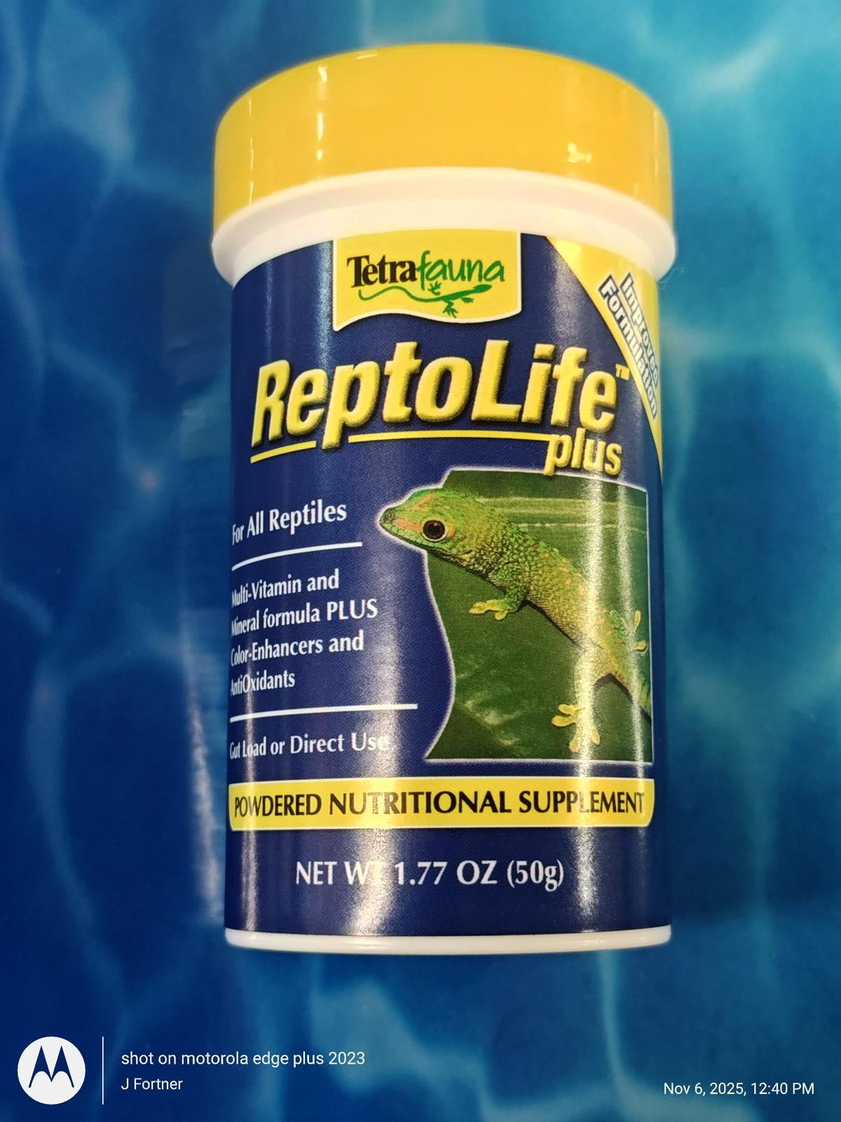 ReptoLife plus powdered nutritional supplement for all reptiles, featuring a green lizard on the label.