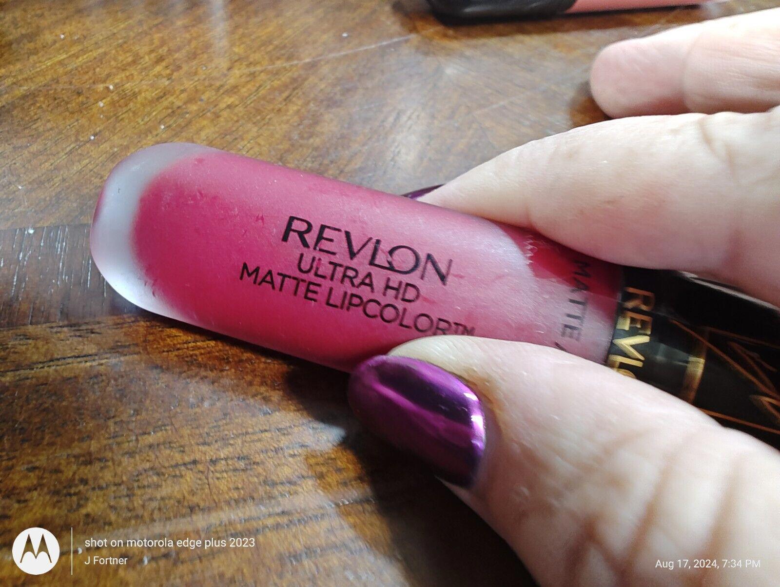 Revlon Ultra HD Matte Lipcolor in vibrant pink shade held in hand.