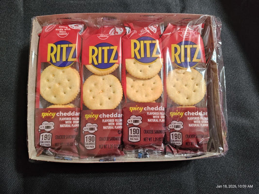 Ritz crackers with zesty cheddar flavor in a pack of four. Perfect for snacking.